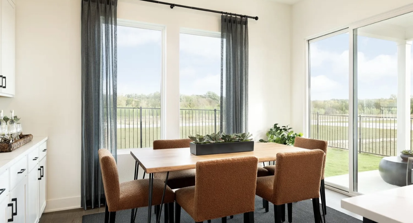 1405 Sweet Bark Street Austin, TX 78745 - Photo 6 of 11 a view of a dining room with furniture window and outside view