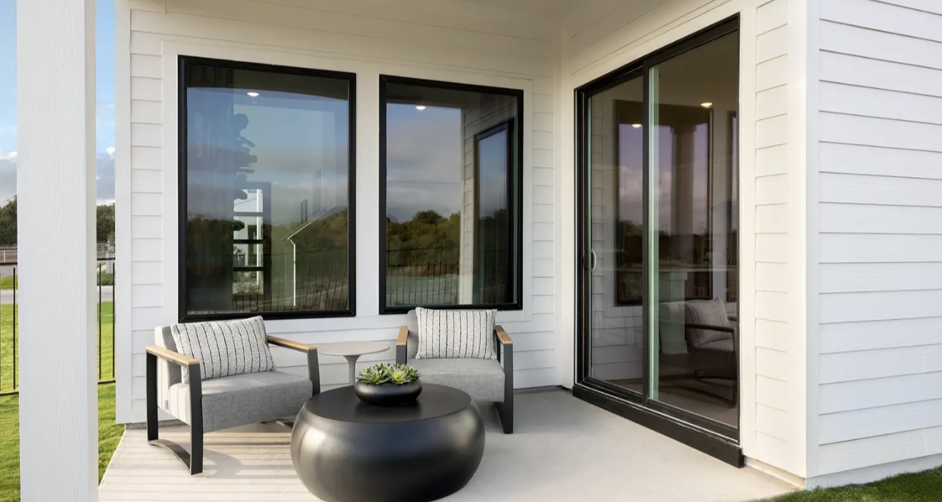 1405 Sweet Bark Street Austin, TX 78745 - Photo 10 of 11 a living room with furniture and large windows