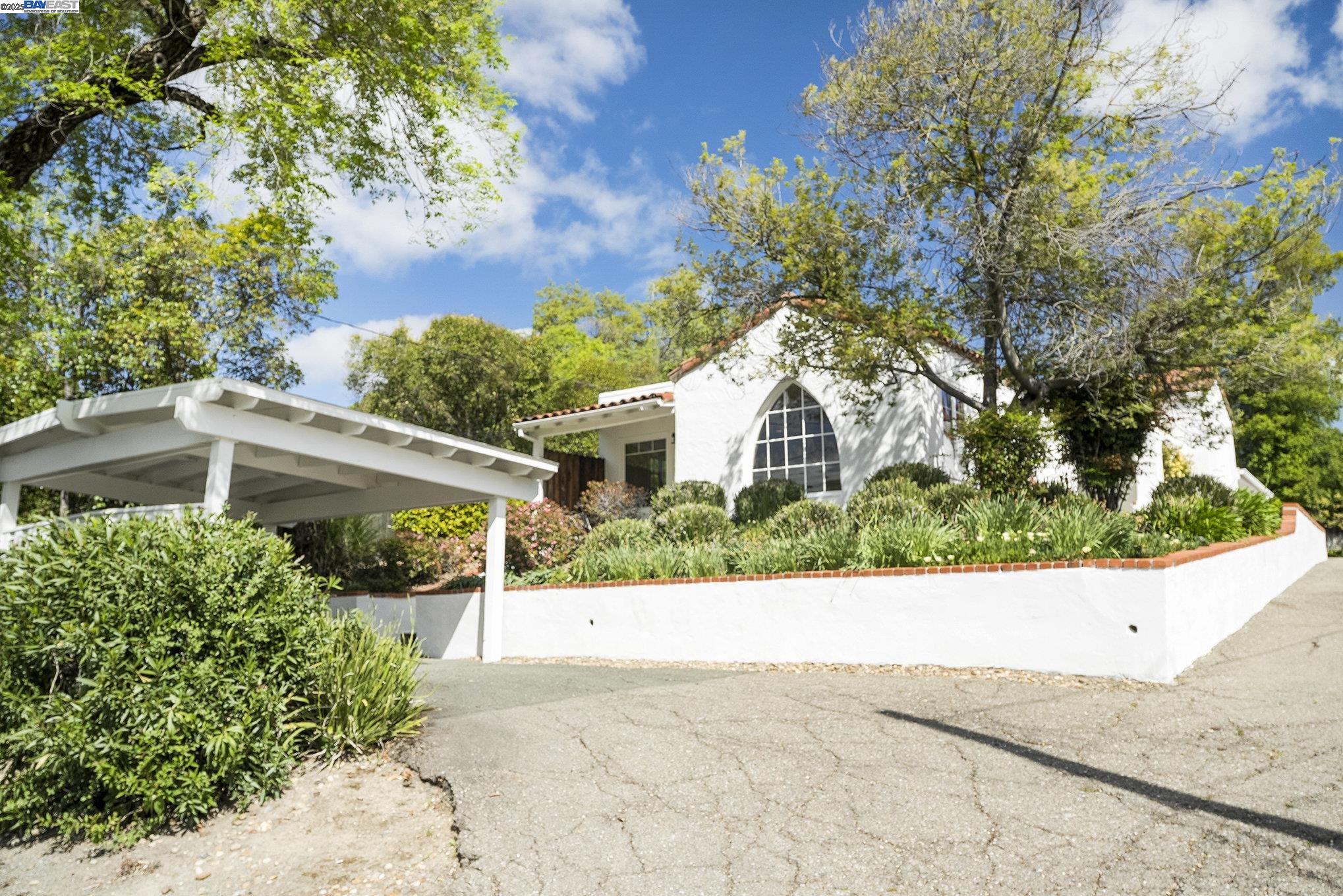 366 Ilo Lane Danville, CA 94526 - Photo 2 of 36 a view of a white house with a small yard plants and a large tree