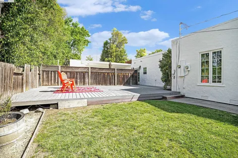 a view of a house with a yard porch and sitting area