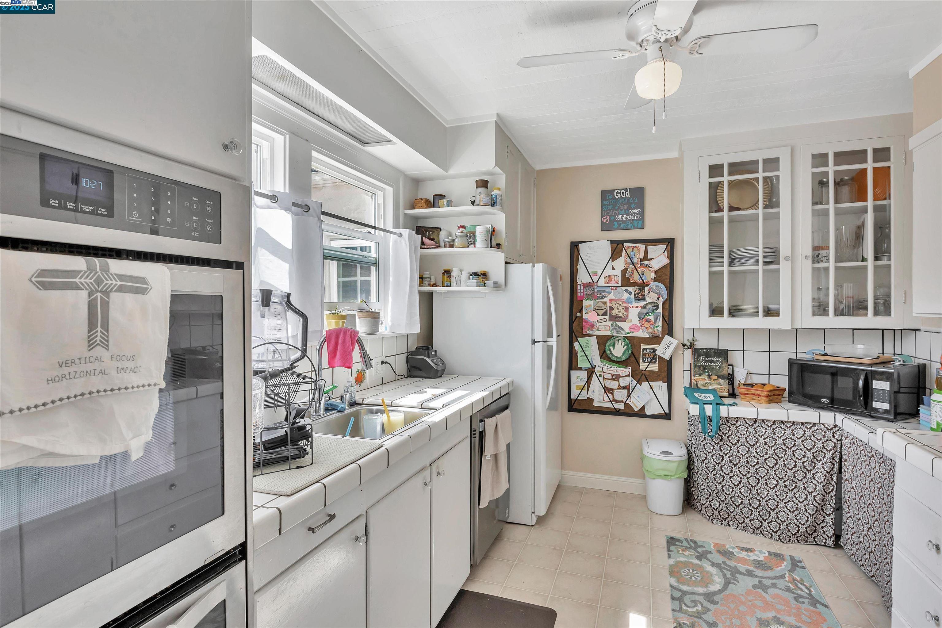 366 Ilo Lane Danville, CA 94526 - Photo 30 of 36 a view of a kitchen with fridge and workspace
