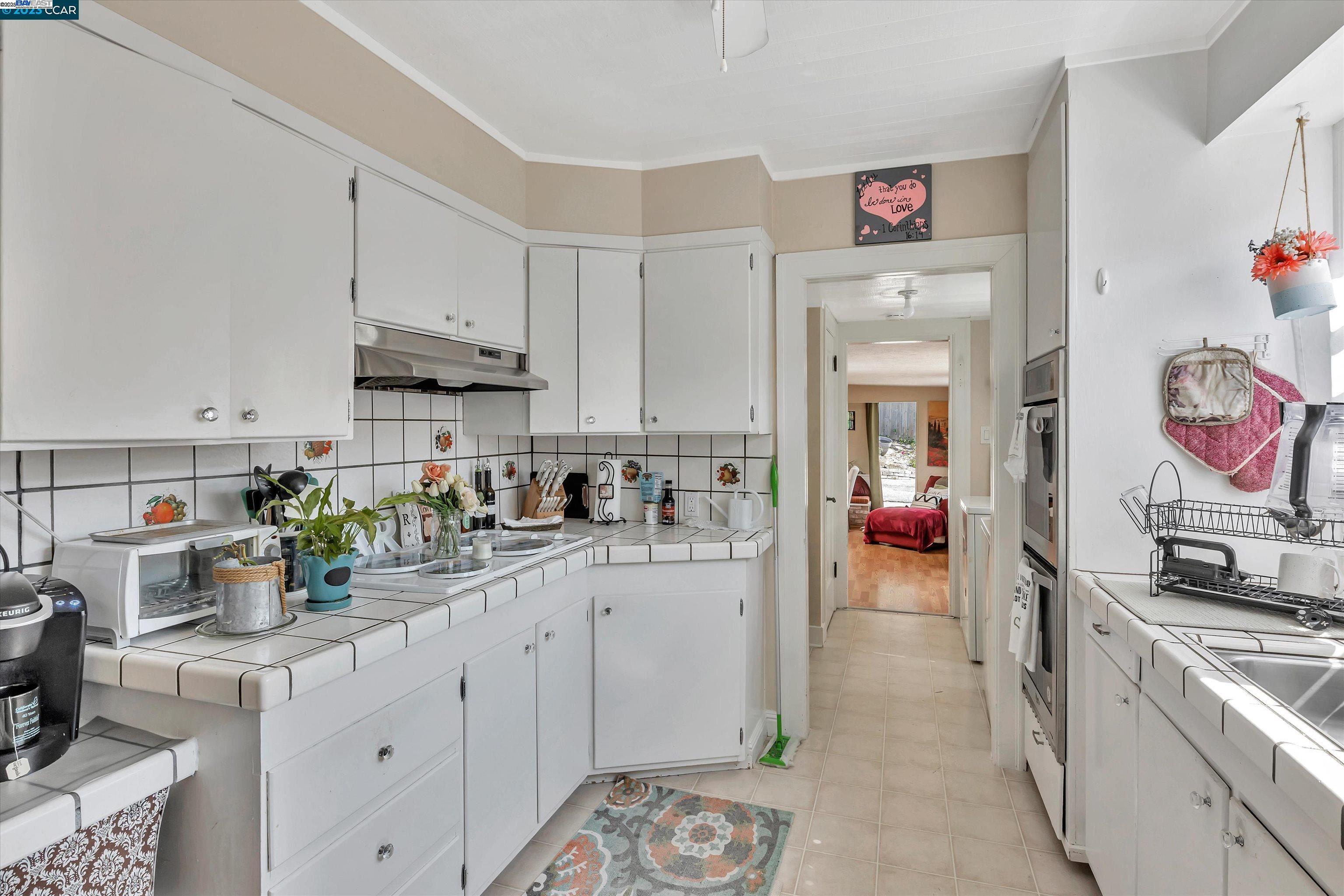 366 Ilo Lane Danville, CA 94526 - Photo 31 of 36 a kitchen filled with white cabinets and appliances