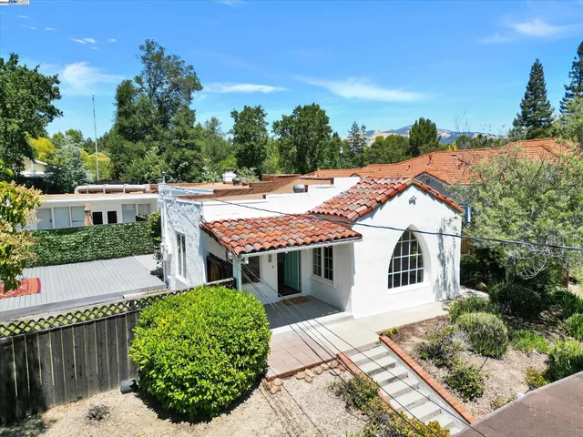 a aerial view of a house with a yard