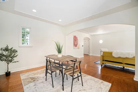 a view of a livingroom with furniture and a potted plant