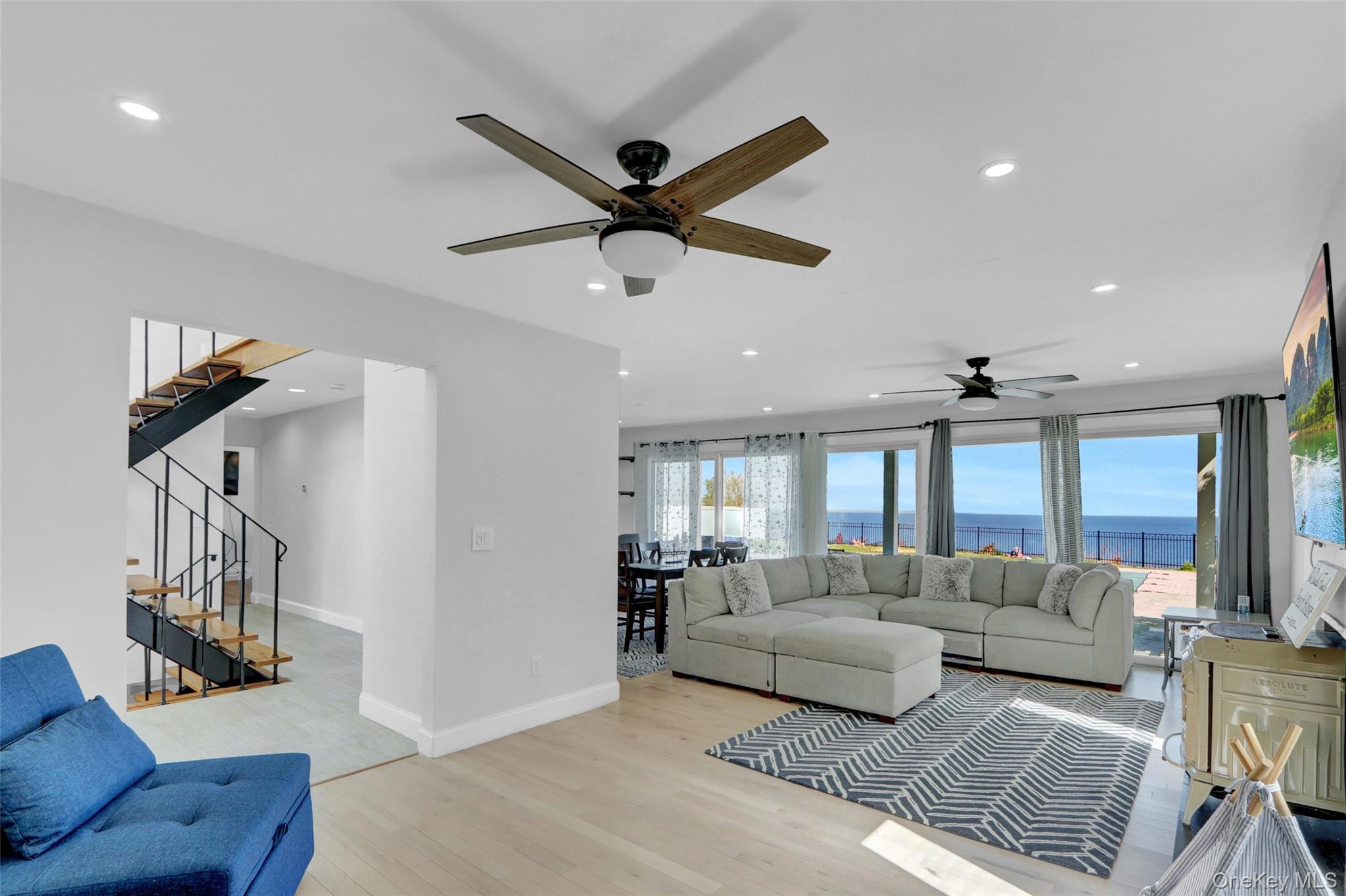 25 Wildwood Road Rocky Point, NY 11778 - Photo 12 of 47 a living room with furniture and a ceiling fan