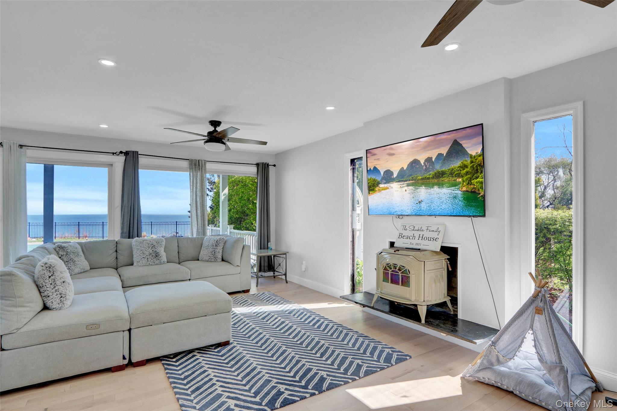 25 Wildwood Road Rocky Point, NY 11778 - Photo 24 of 47 a living room with furniture and a fireplace