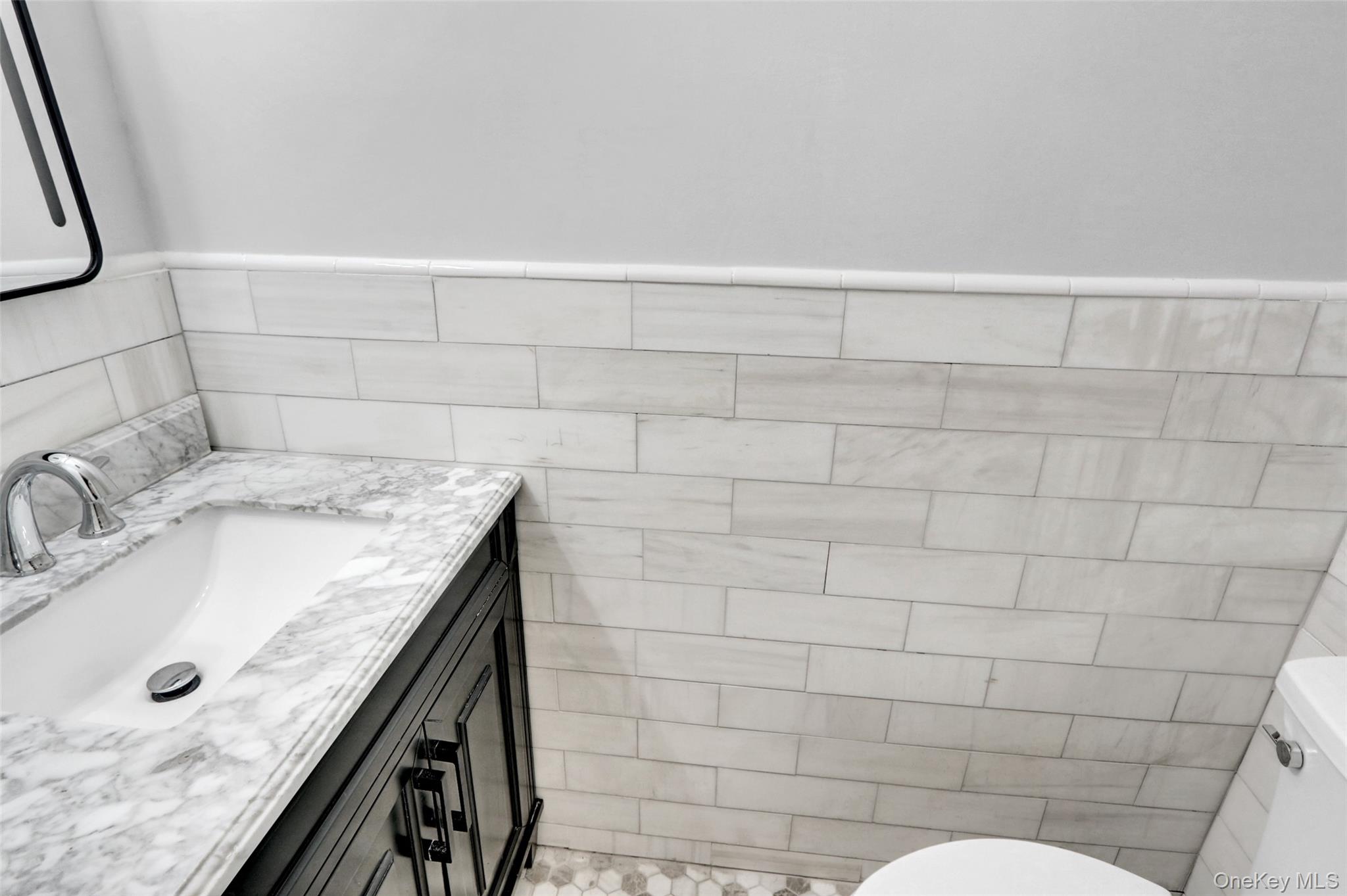 25 Wildwood Road Rocky Point, NY 11778 - Photo 25 of 47 a bathroom with a granite countertop sink a toilet and mirror
