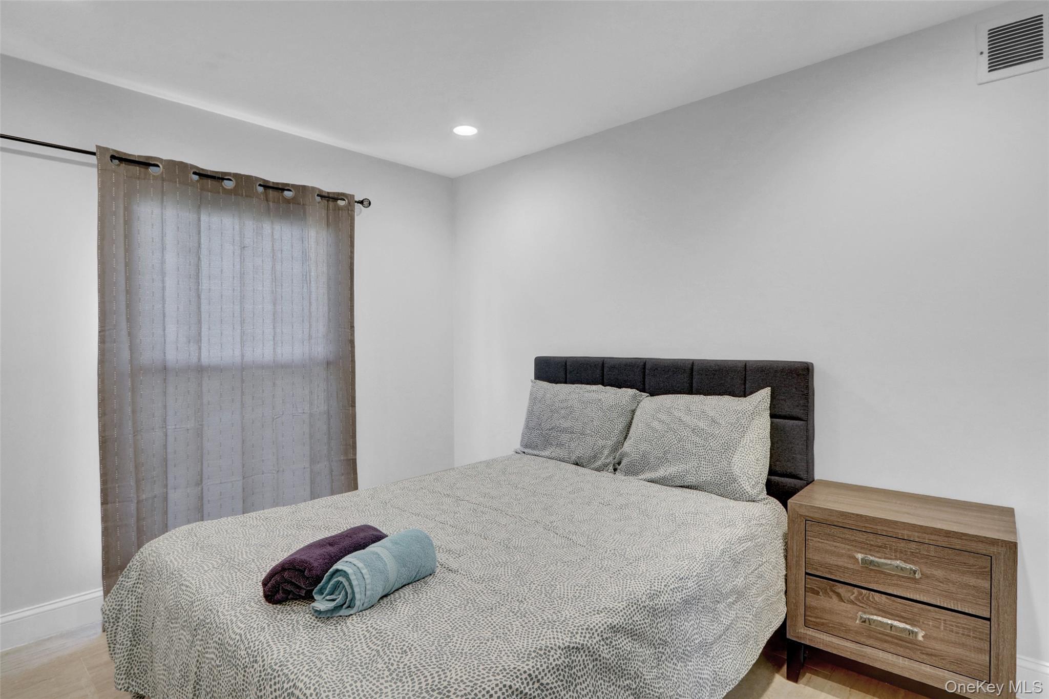 25 Wildwood Road Rocky Point, NY 11778 - Photo 26 of 47 a bedroom with a bed and a dresser