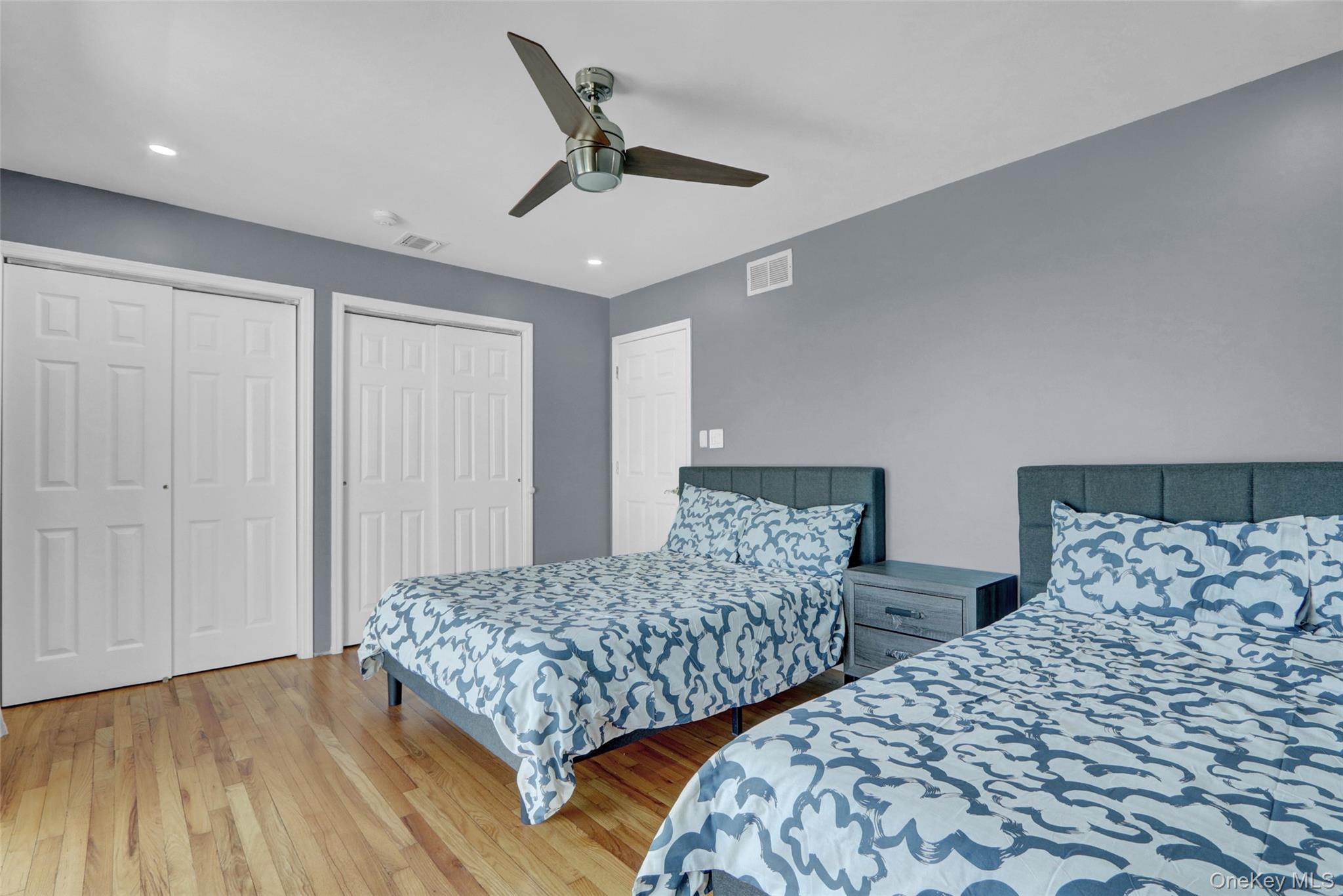 25 Wildwood Road Rocky Point, NY 11778 - Photo 34 of 47 a bedroom with two beds and painting on the wall