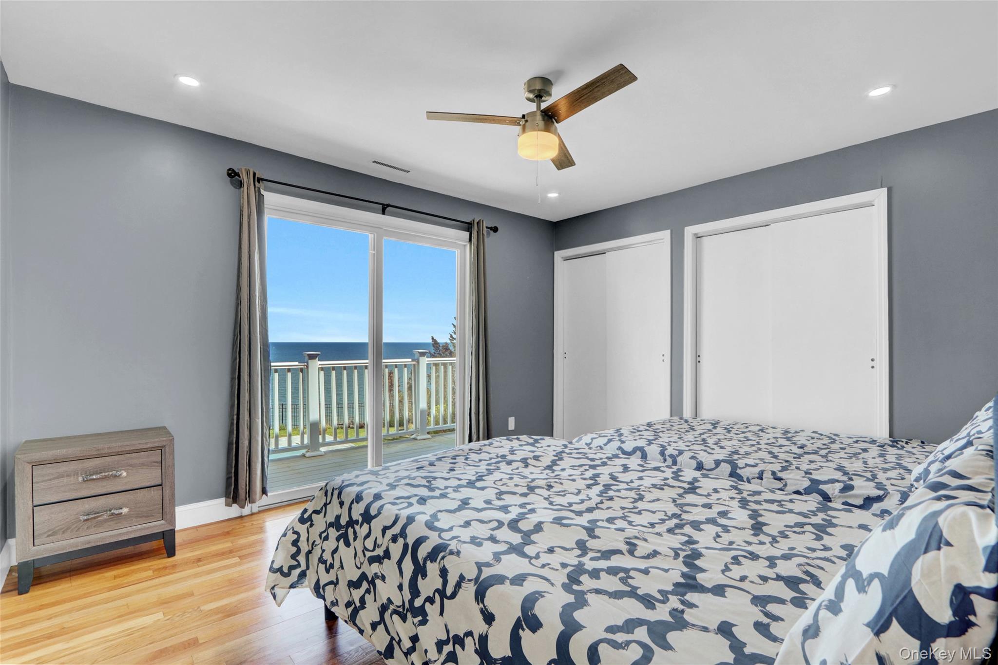 25 Wildwood Road Rocky Point, NY 11778 - Photo 35 of 47 a large bed sitting in a bedroom next to a window