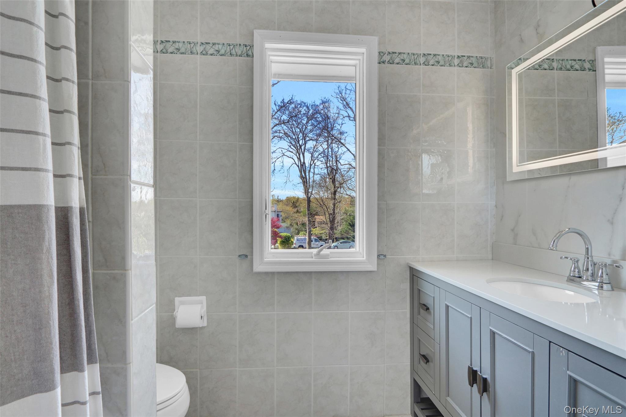 25 Wildwood Road Rocky Point, NY 11778 - Photo 36 of 47 a bathroom with a sink a toilet and shower