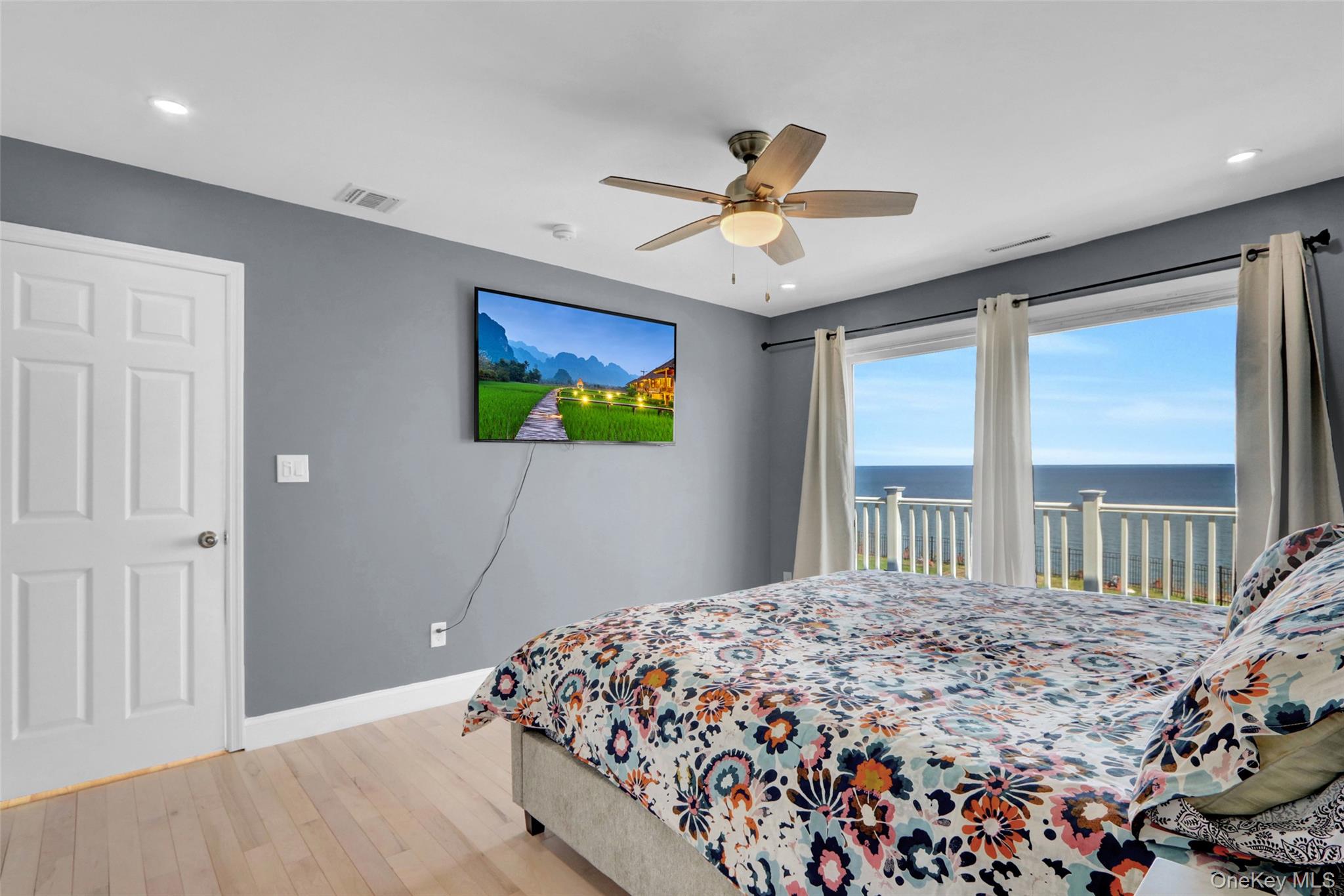 25 Wildwood Road Rocky Point, NY 11778 - Photo 38 of 47 a bedroom with a bed and a large window