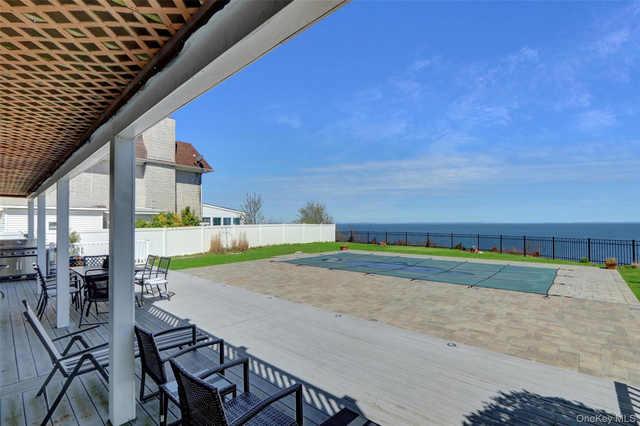 25 Wildwood Road Rocky Point, NY 11778 - Photo 10 of 47 a view of yard with swimming pool outdoor seating and city view
