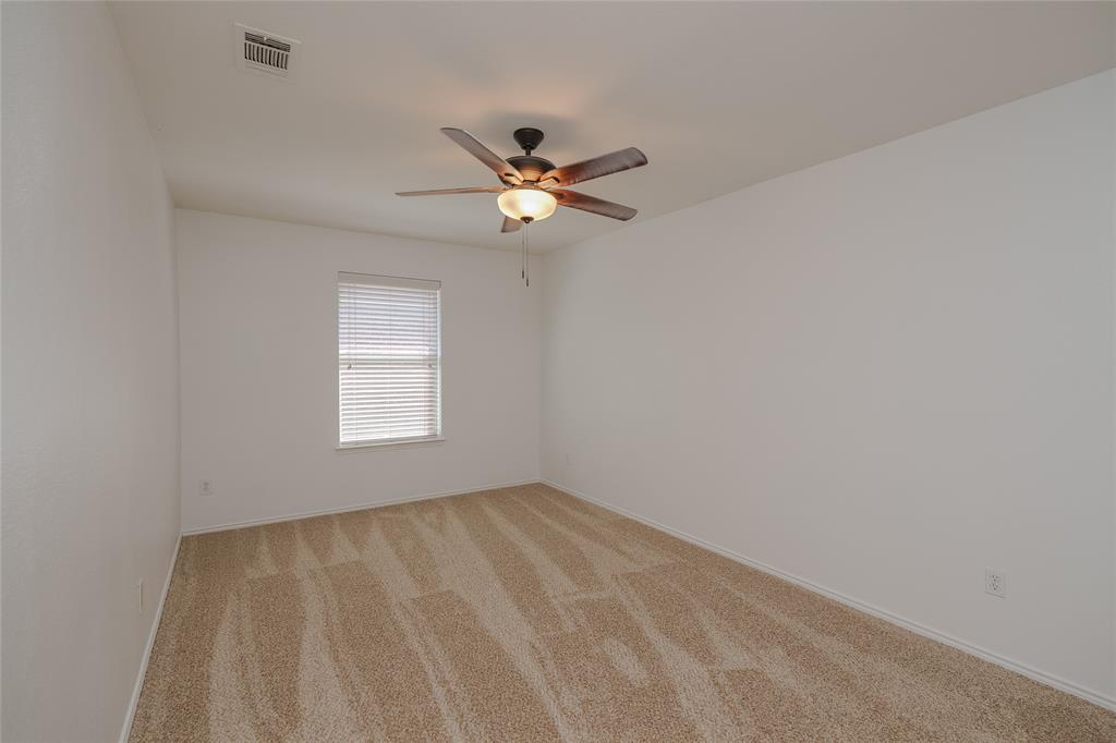 2912 Lighthouse Drive Denton, TX 76210 - Photo 28 of 34 a view of room with a ceiling fan and window