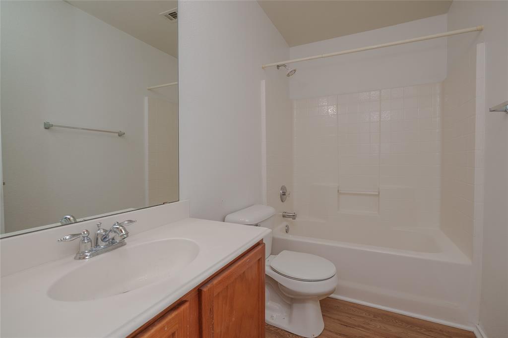 2912 Lighthouse Drive Denton, TX 76210 - Photo 30 of 34 a bathroom with a sink toilet and shower