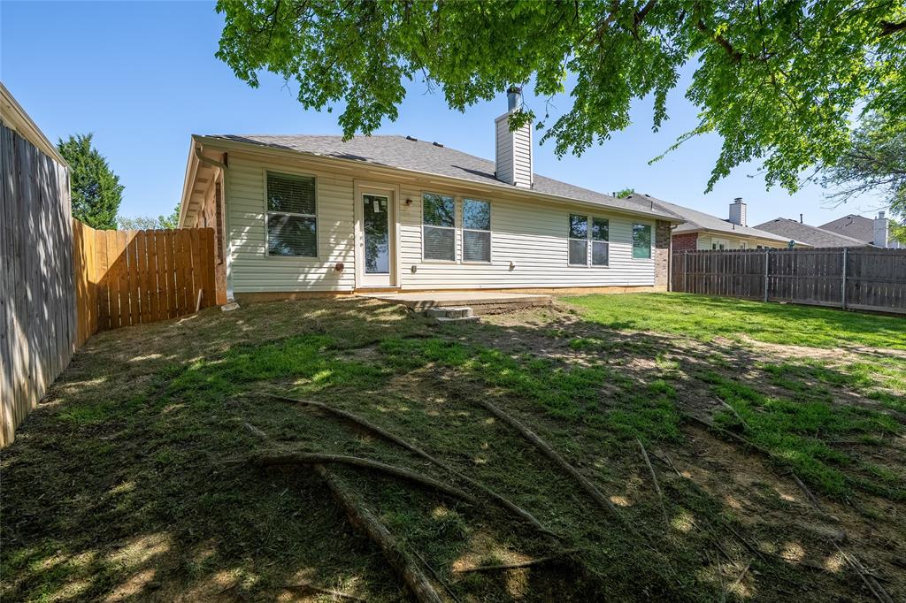 2912 Lighthouse Drive Denton, TX 76210 - Photo 32 of 34 a view of a house with backyard and sitting area