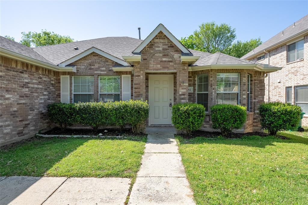 2912 Lighthouse Drive Denton, TX 76210 - Photo 4 of 34 a front view of a house with a yard