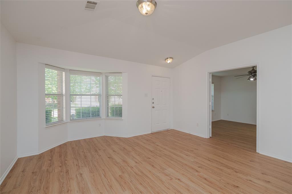 2912 Lighthouse Drive Denton, TX 76210 - Photo 6 of 34 a view of empty room with wooden floor and fan