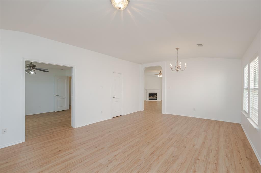 2912 Lighthouse Drive Denton, TX 76210 - Photo 7 of 34 an empty room with wooden floor and windows