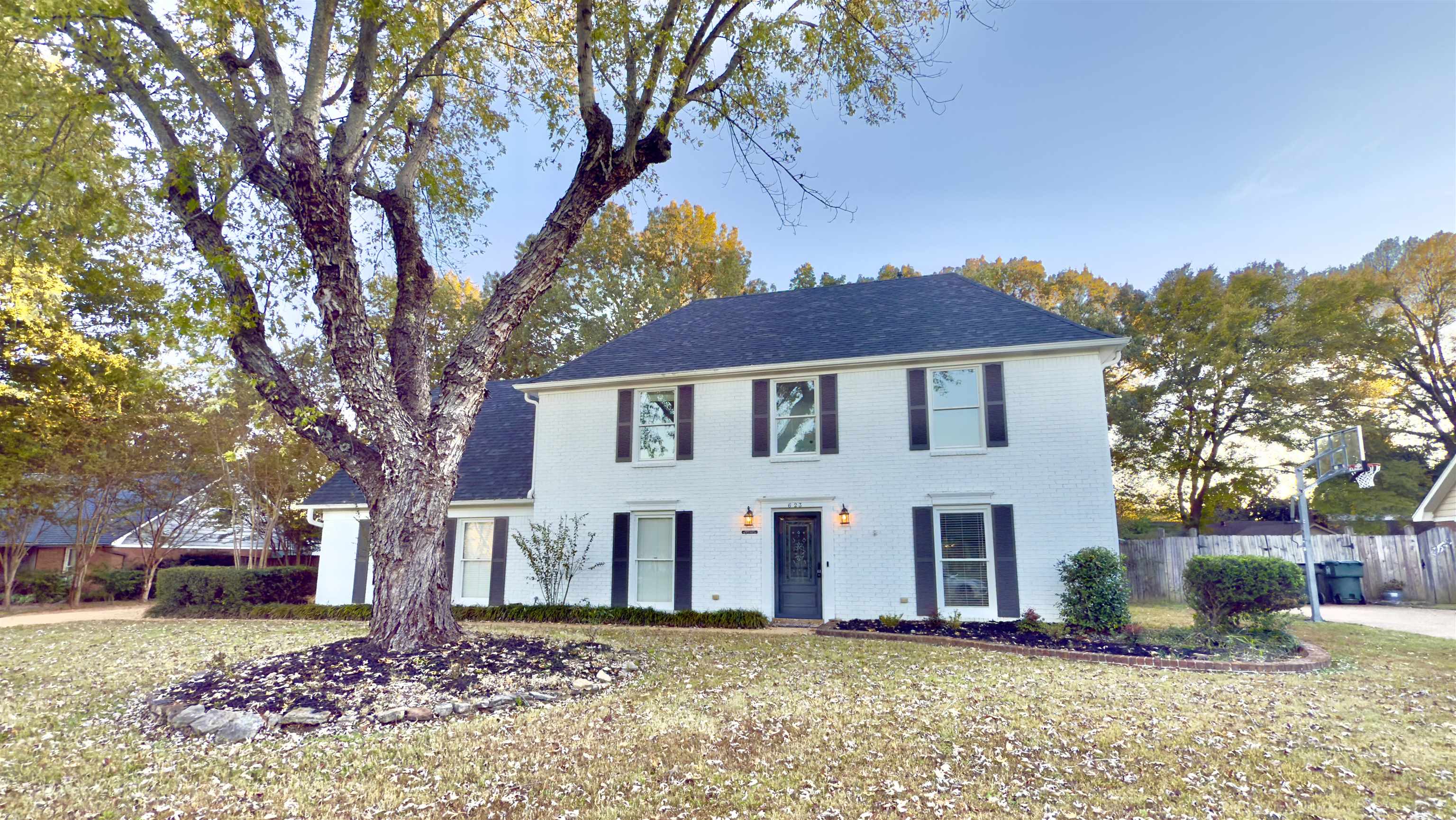 a front view of a house with a yard