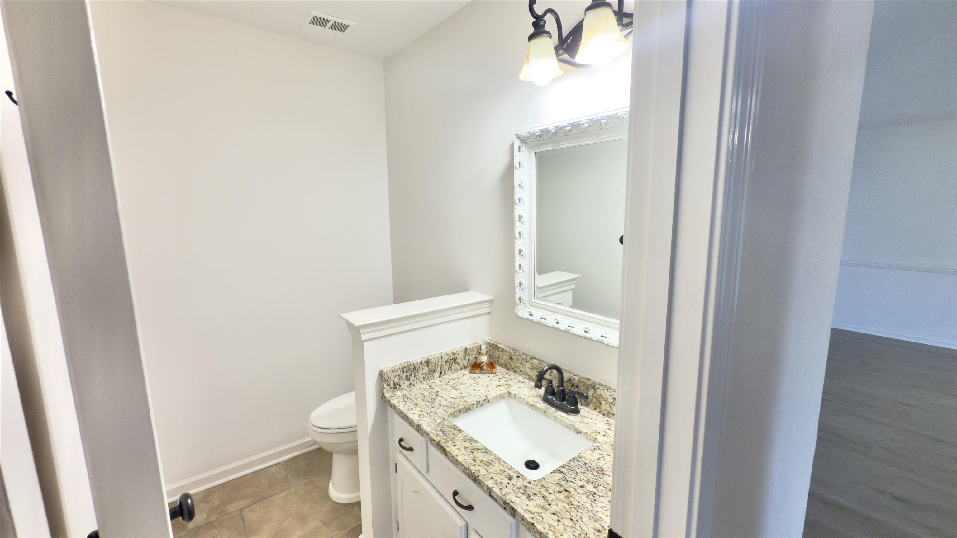 623 Winford Drive Collierville, TN 38017 - Photo 11 of 22 a bathroom with a granite countertop sink and a mirror