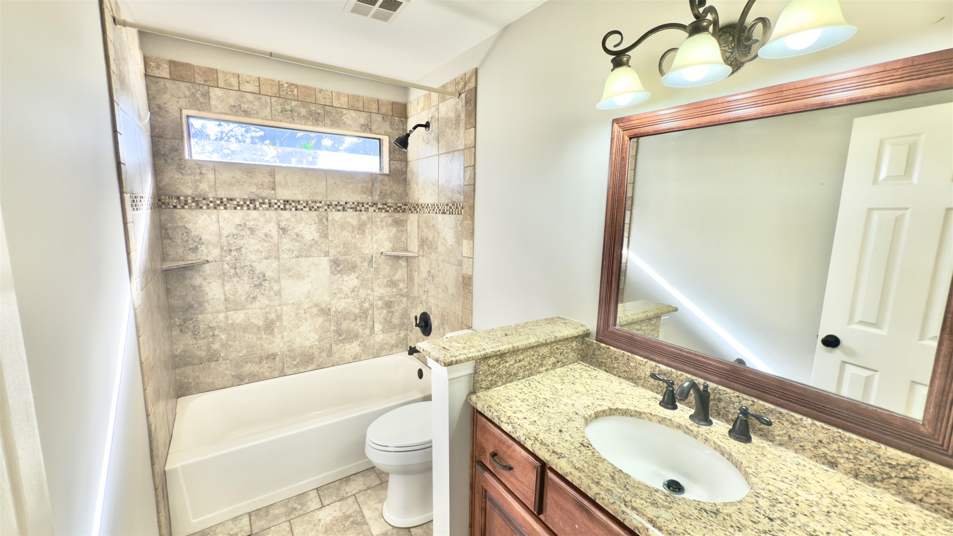 623 Winford Drive Collierville, TN 38017 - Photo 17 of 22 a bathroom with a granite countertop sink toilet and shower