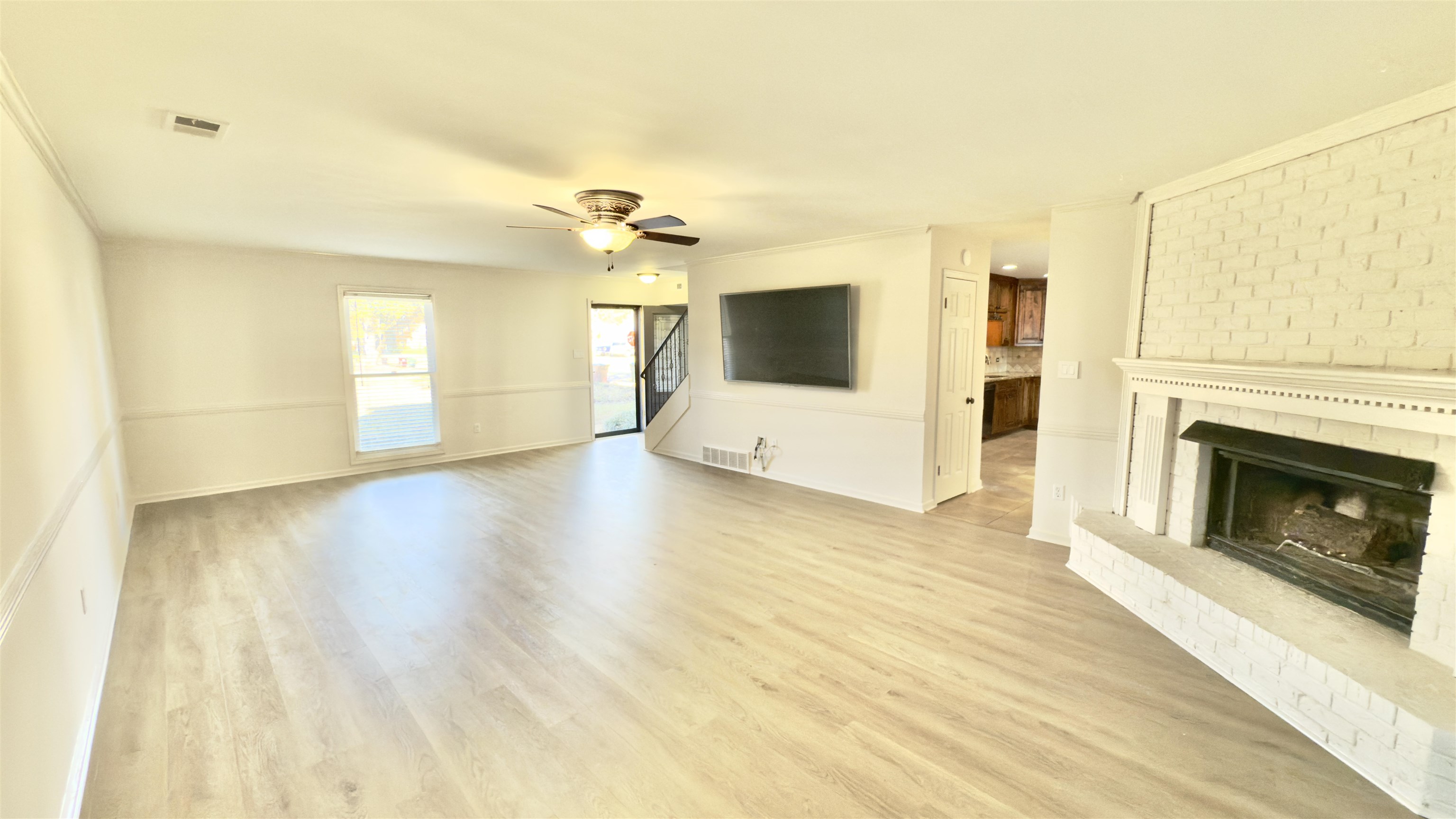 623 Winford Drive Collierville, TN 38017 - Photo 4 of 22 a view of a livingroom with an empty space and a fireplace