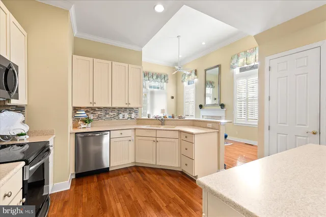 a spacious bathroom with a granite countertop sink mirror and a bathtub