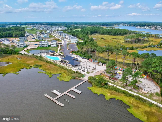an aerial view of a residential houses with outdoor space swimming pool and outdoor seating