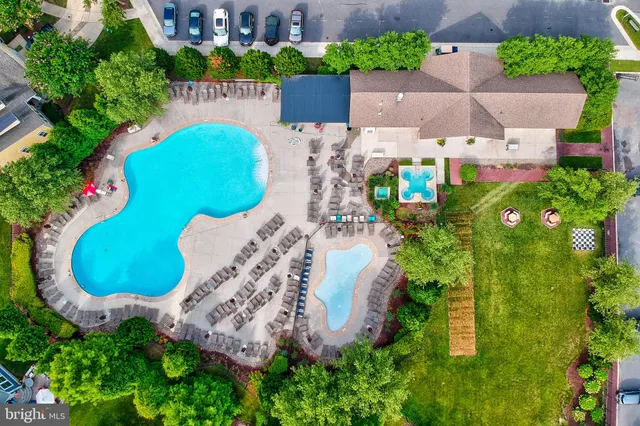 a view of a swimming pool with a patio