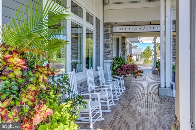 an aerial view of a golf course with a lake view