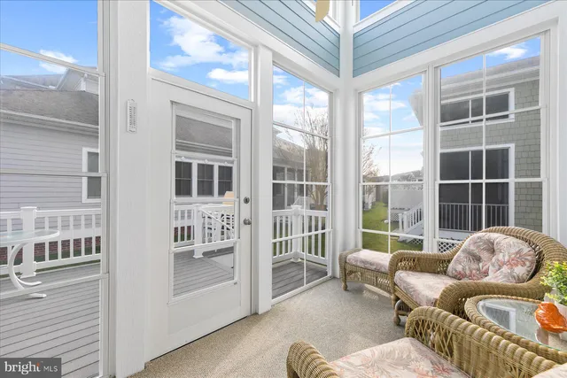 a living room with furniture and windows