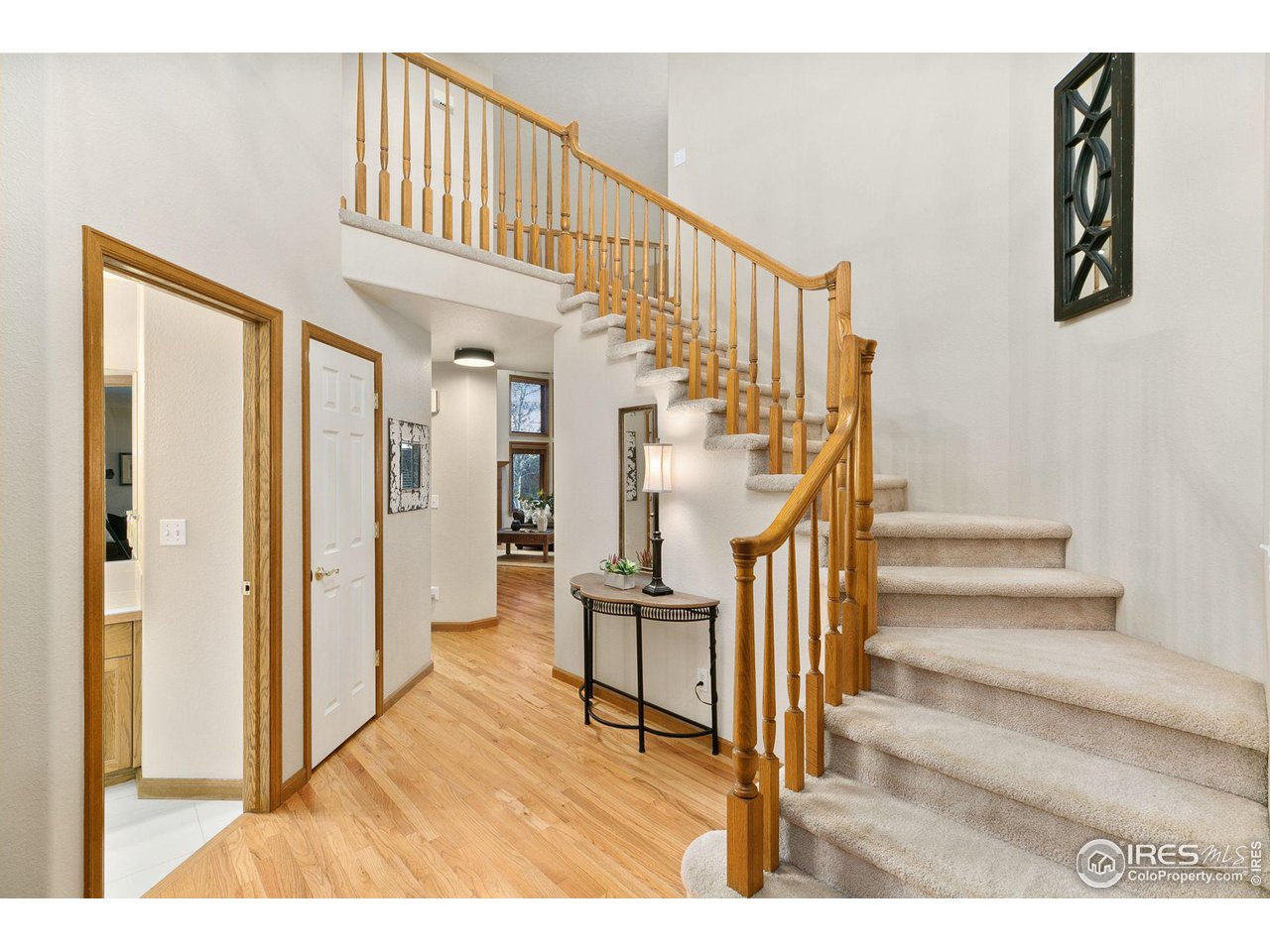 32593 Stagecoach Road Windsor, CO 80550 - Photo 14 of 28 a view of entryway and hall with wooden floor