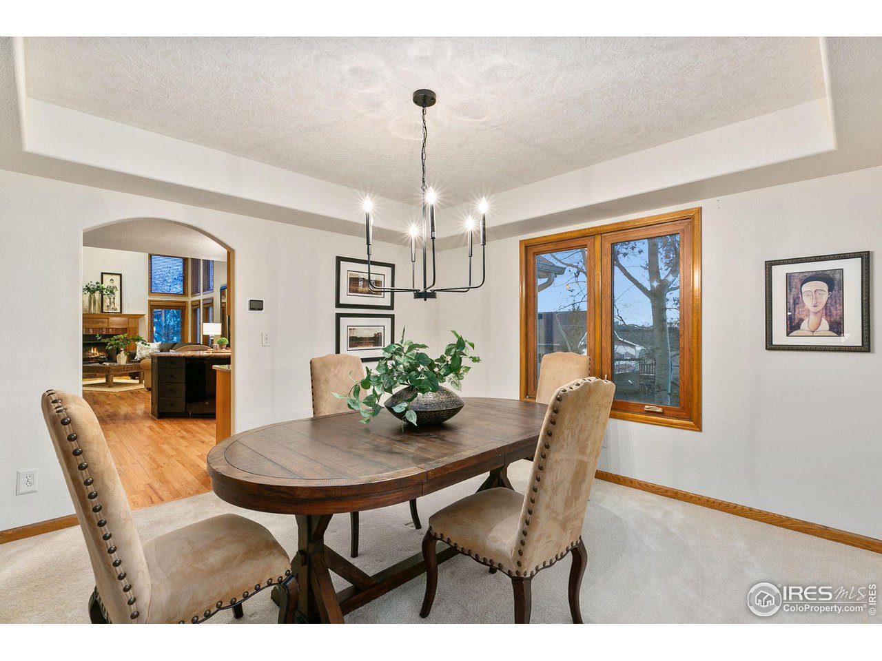 32593 Stagecoach Road Windsor, CO 80550 - Photo 19 of 28 a dining room with furniture a chandelier and window