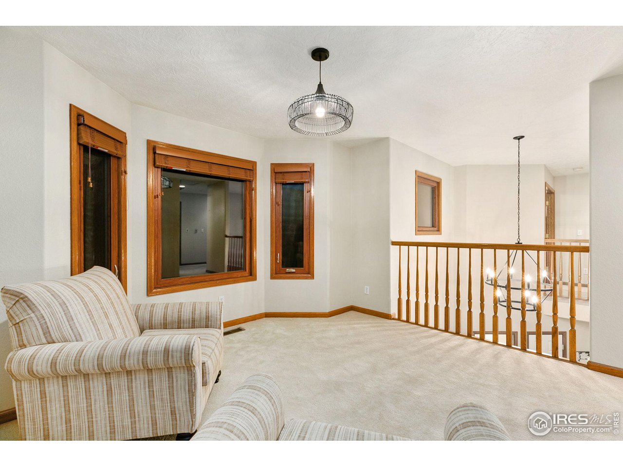 32593 Stagecoach Road Windsor, CO 80550 - Photo 26 of 28 a view of a livingroom with a ceiling fan and window