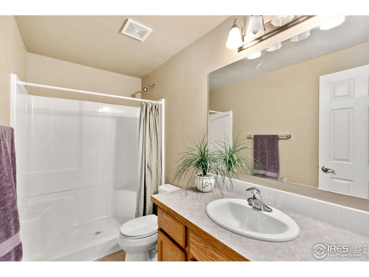 32593 Stagecoach Road Windsor, CO 80550 - Photo 28 of 28 a bathroom with a sink toilet and shower
