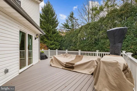 a balcony with furniture and wooden floor