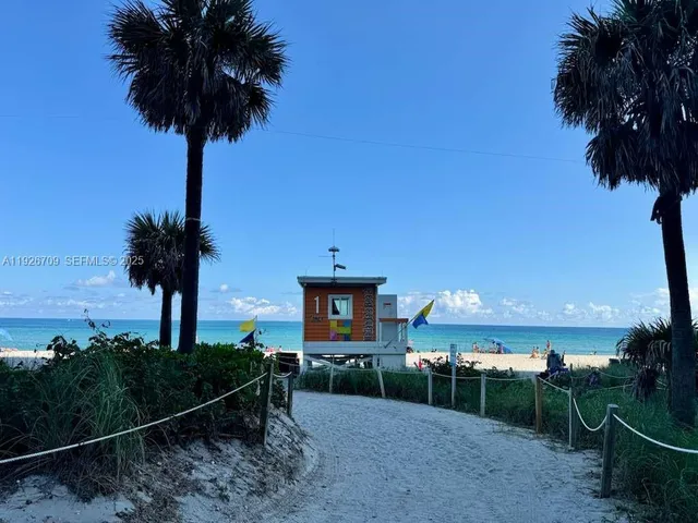 a view of a garden with a house