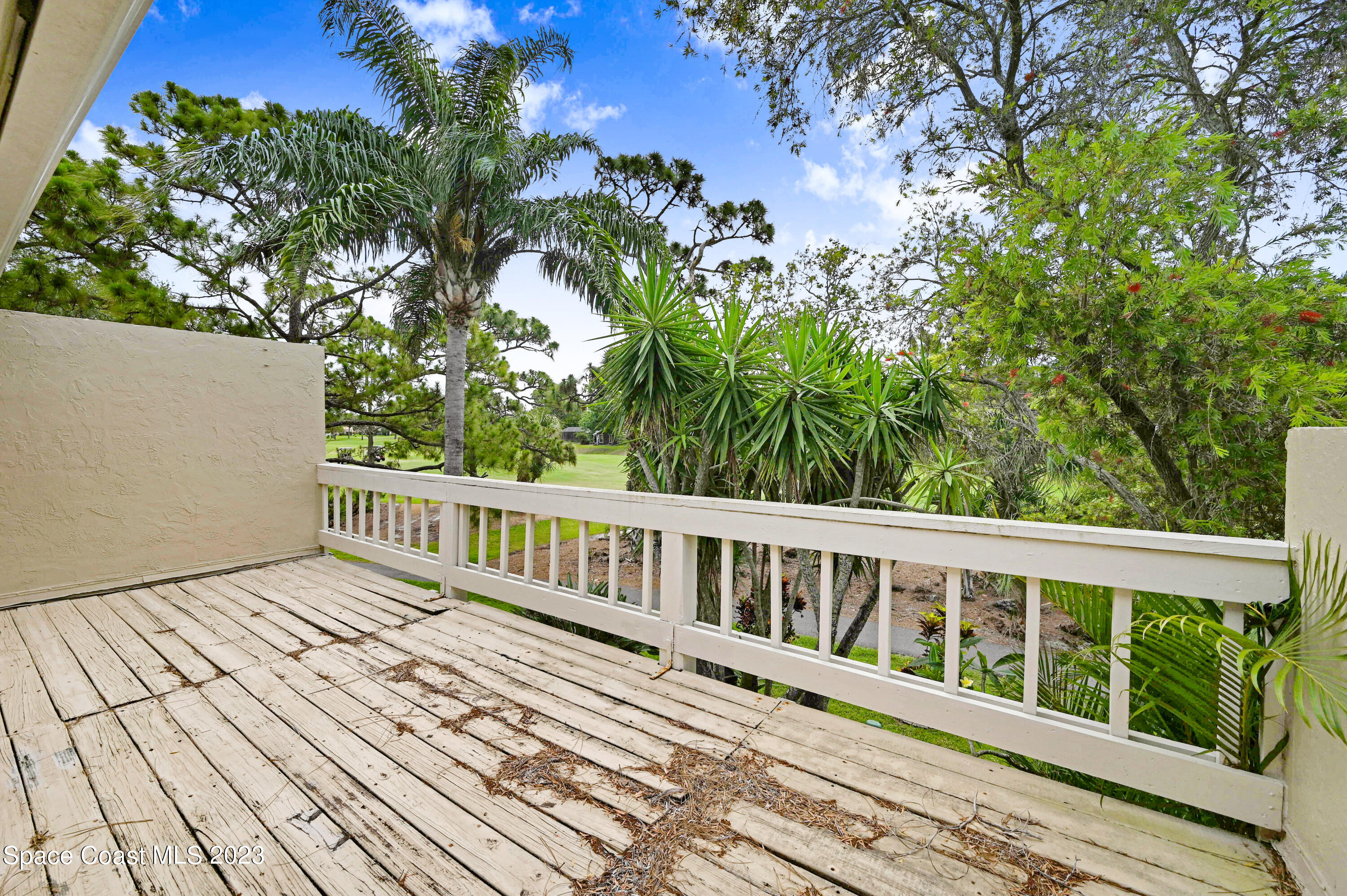 229 Augusta Way Melbourne, FL 32940 - Photo 23 of 39 a view of wooden deck