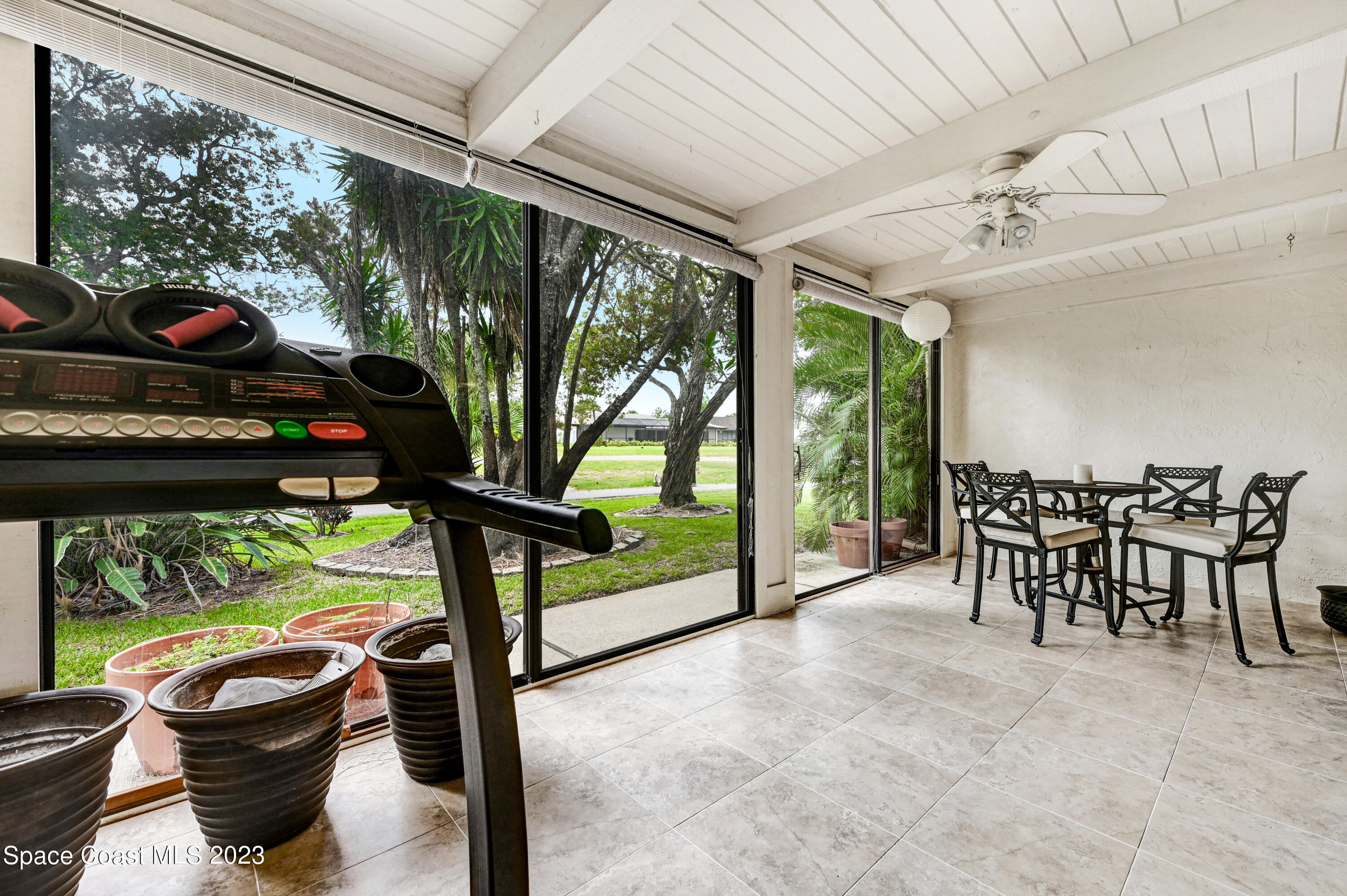 229 Augusta Way Melbourne, FL 32940 - Photo 24 of 39 a view of a porch with furniture and a backyard