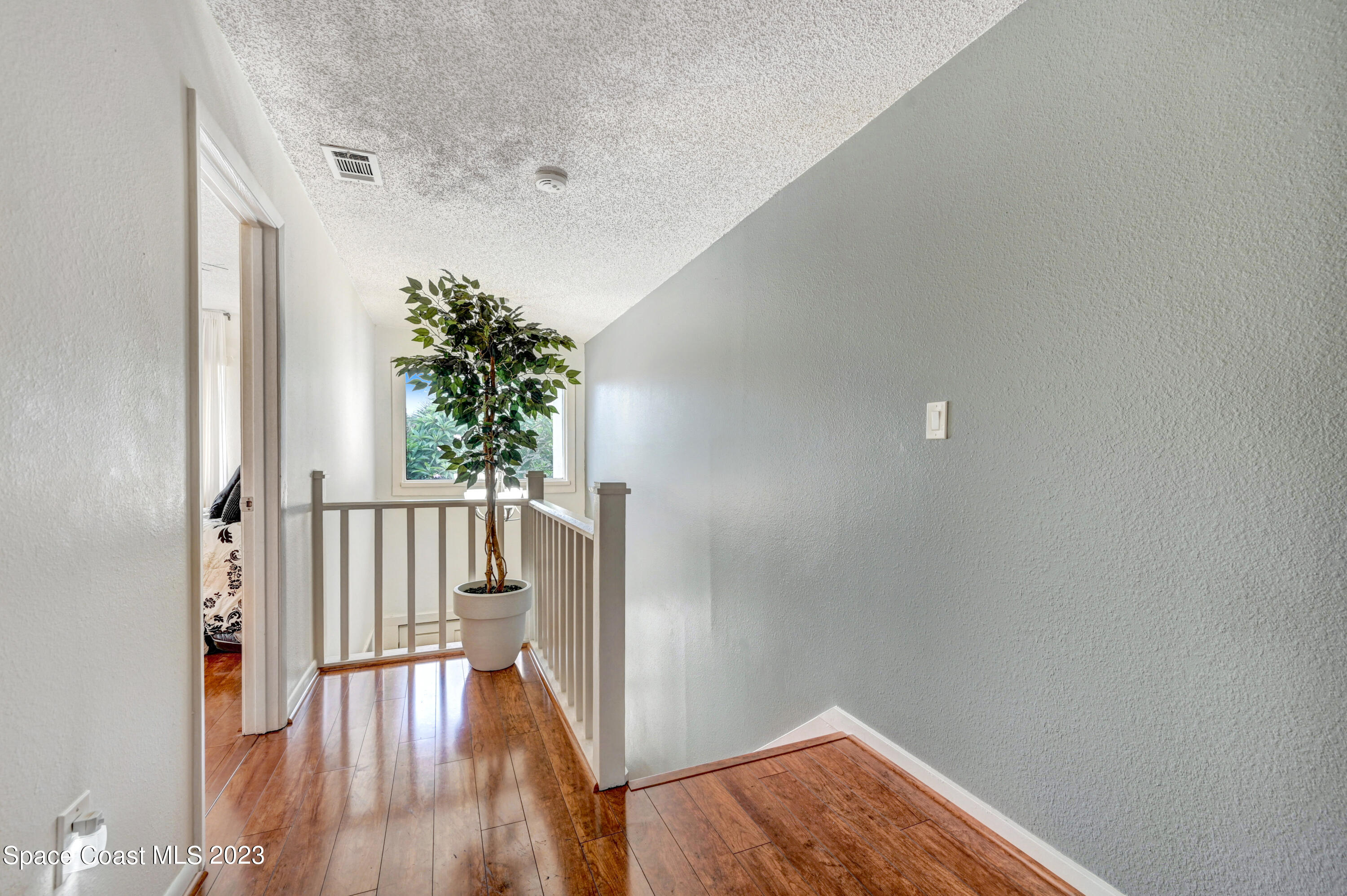 229 Augusta Way Melbourne, FL 32940 - Photo 27 of 39 a view of entryway with wooden floor