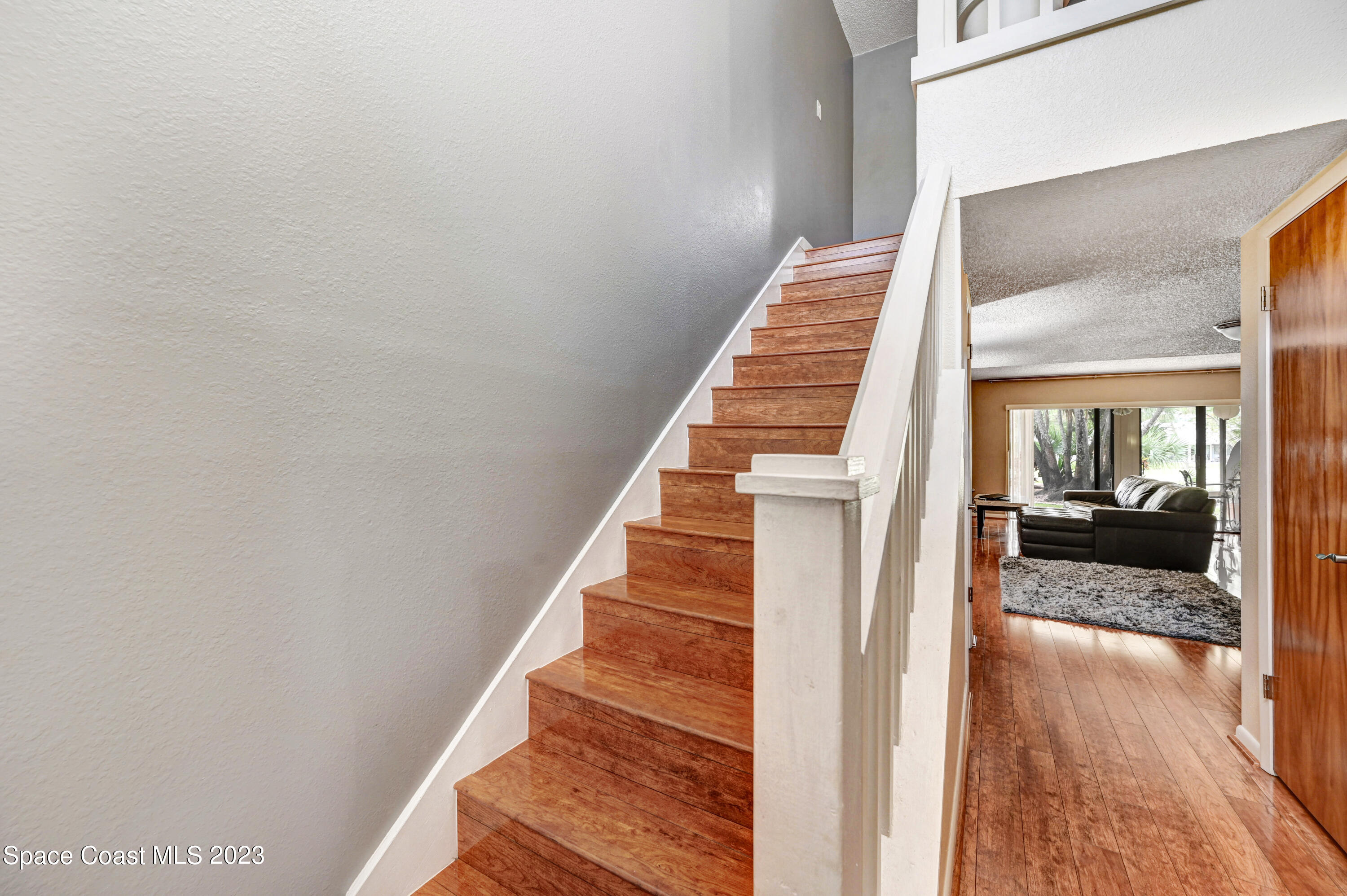 229 Augusta Way Melbourne, FL 32940 - Photo 3 of 39 a view of entryway and hall with wooden floor