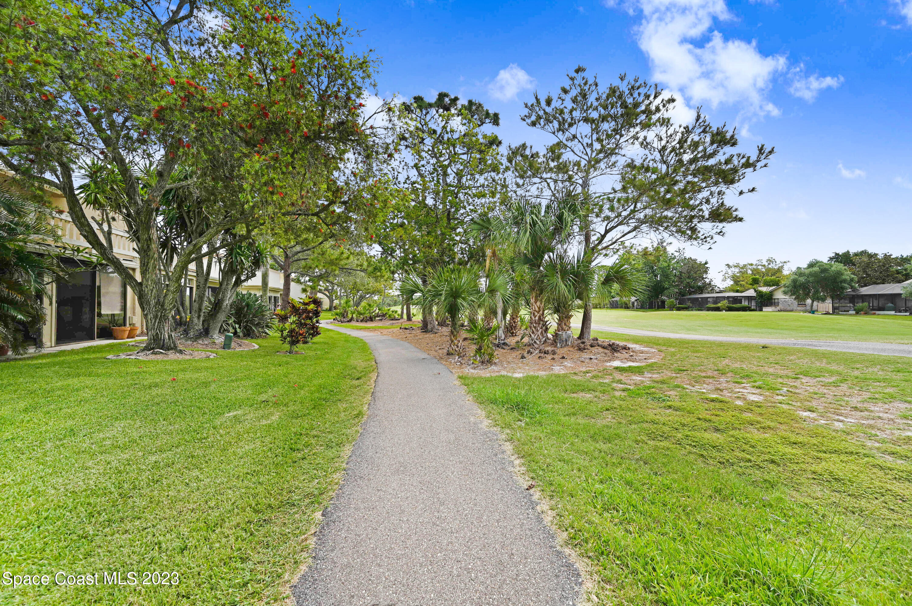 229 Augusta Way Melbourne, FL 32940 - Photo 34 of 39 a view of a park with large trees