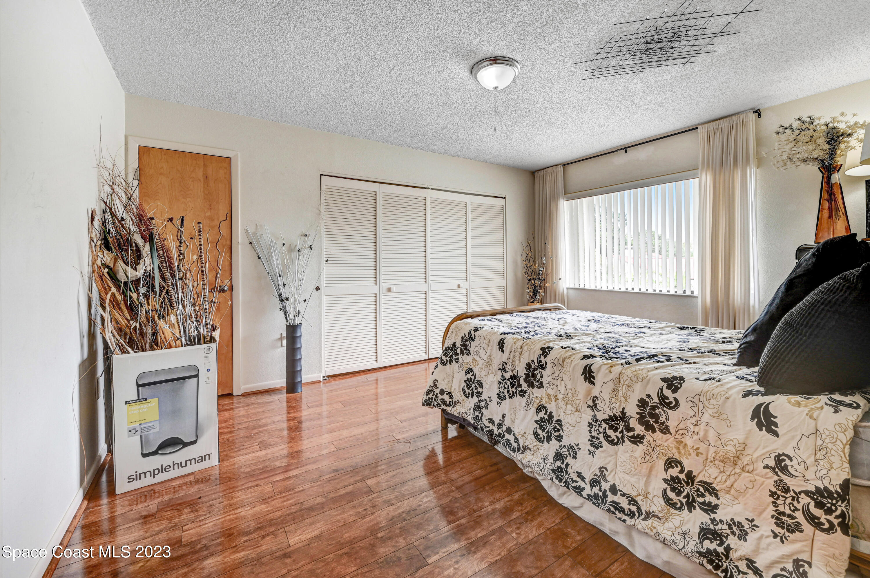 229 Augusta Way Melbourne, FL 32940 - Photo 36 of 39 a bedroom with a bed and a window