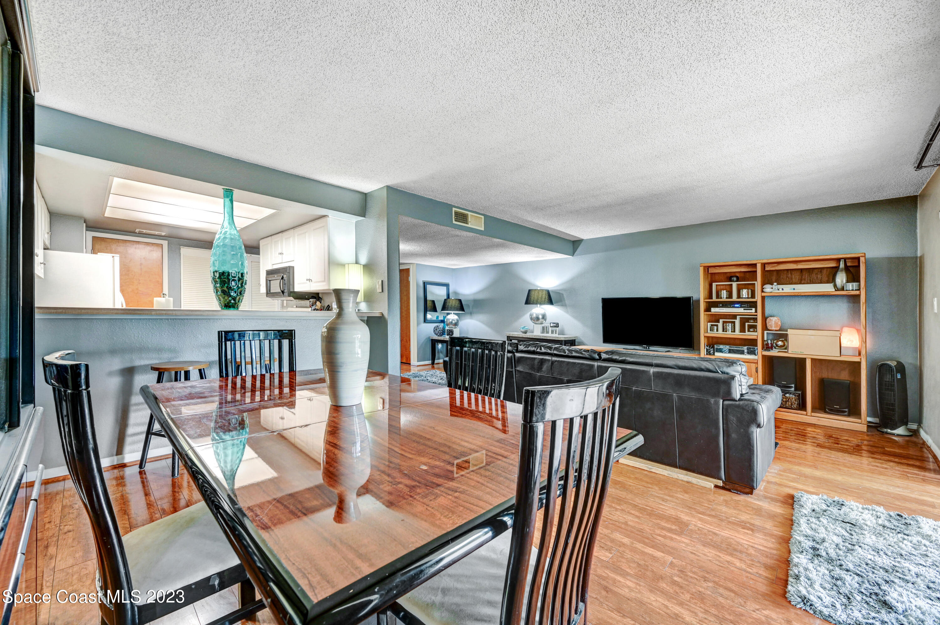 229 Augusta Way Melbourne, FL 32940 - Photo 6 of 39 a view of a dining room with furniture and wooden floor