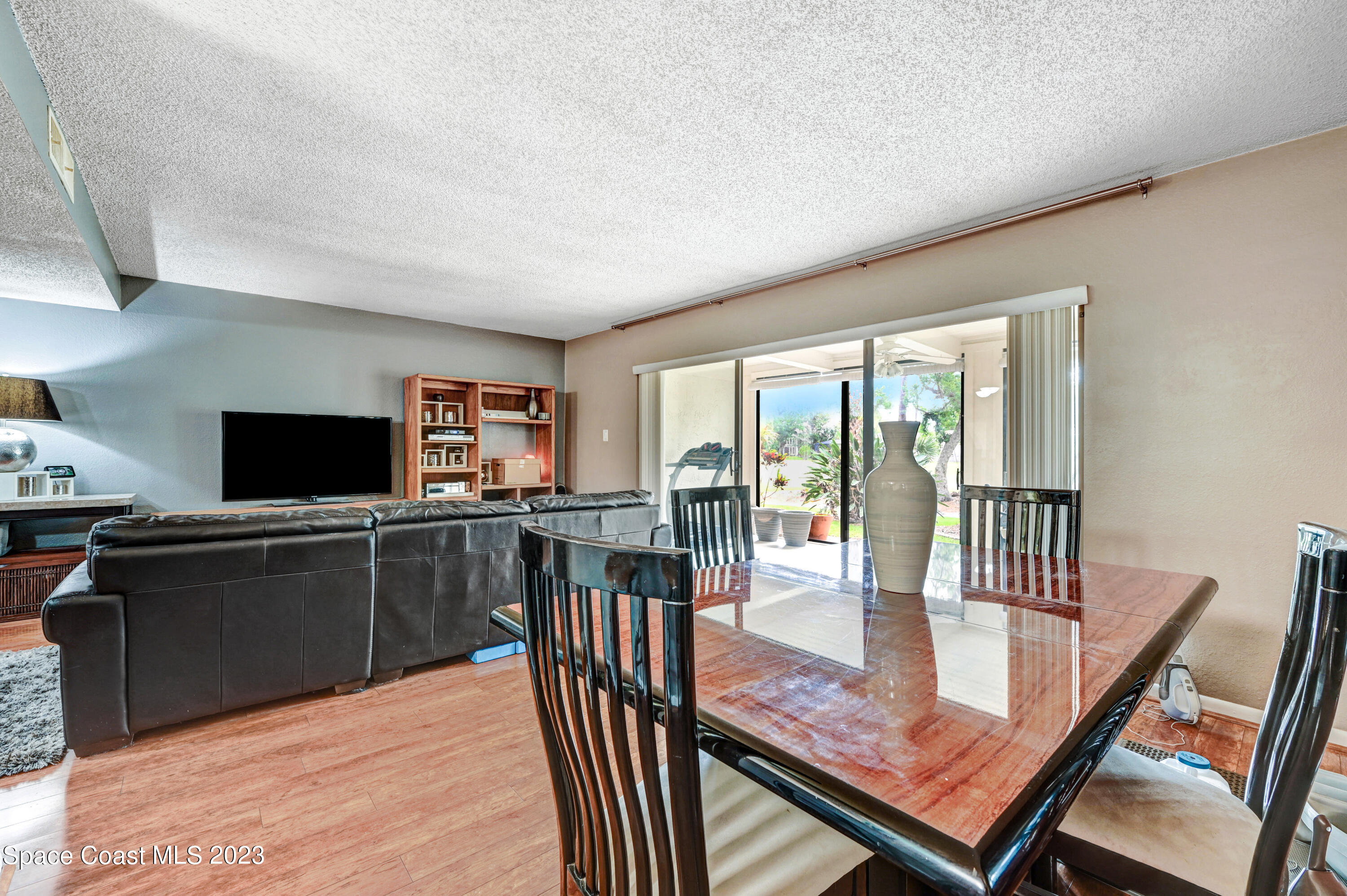 229 Augusta Way Melbourne, FL 32940 - Photo 7 of 39 a view of a dining room with furniture window and wooden floor