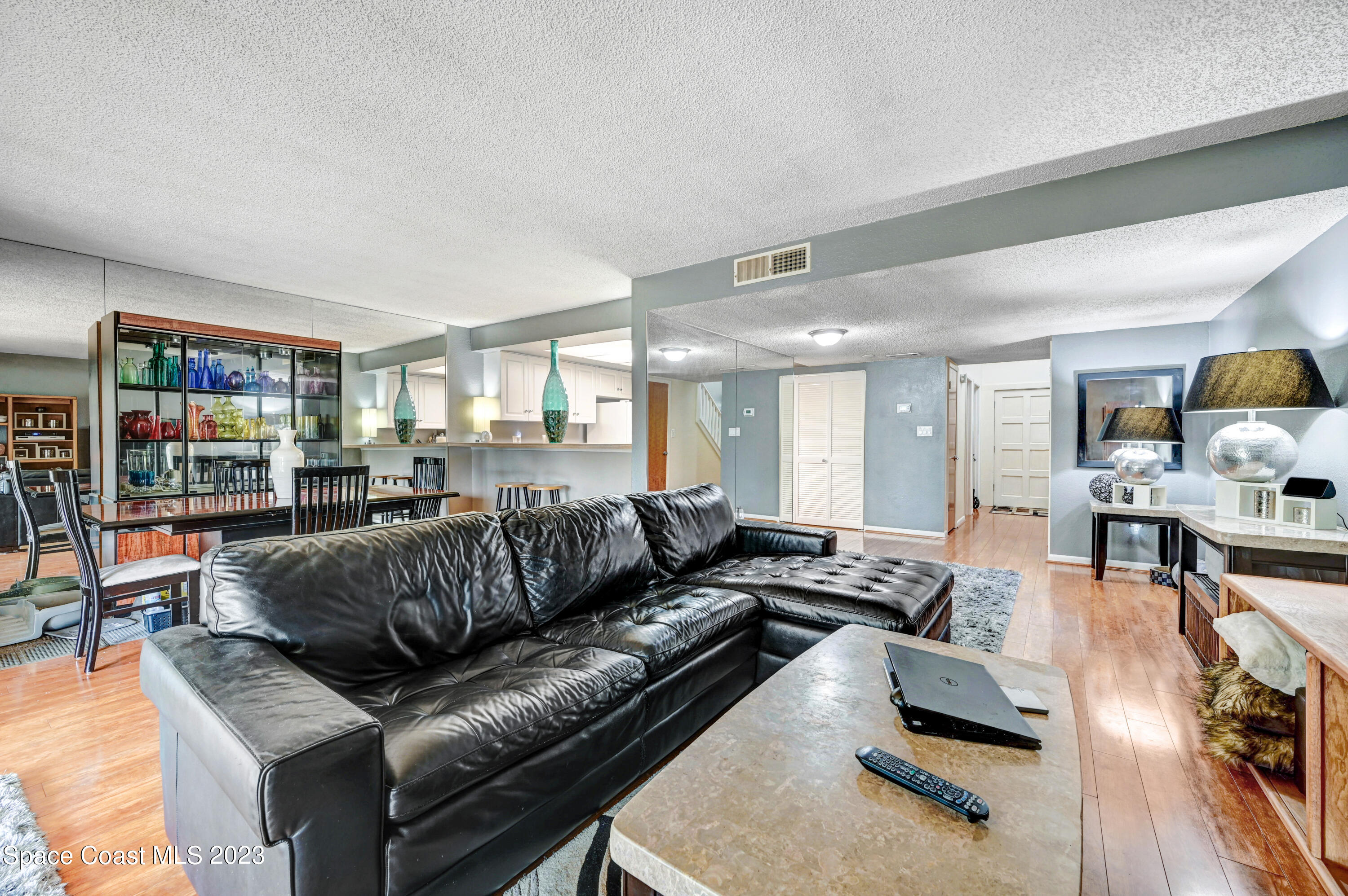 229 Augusta Way Melbourne, FL 32940 - Photo 9 of 39 a living room with furniture and a wooden floor