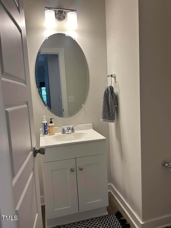 816 Laurel Gate Drive Wake Forest, NC 27587 - Photo 17 of 20 a bathroom with a sink and mirror