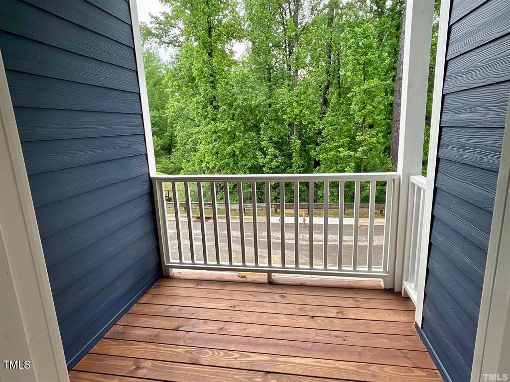 816 Laurel Gate Drive Wake Forest, NC 27587 - Photo 6 of 20 a view of a balcony with wooden floor