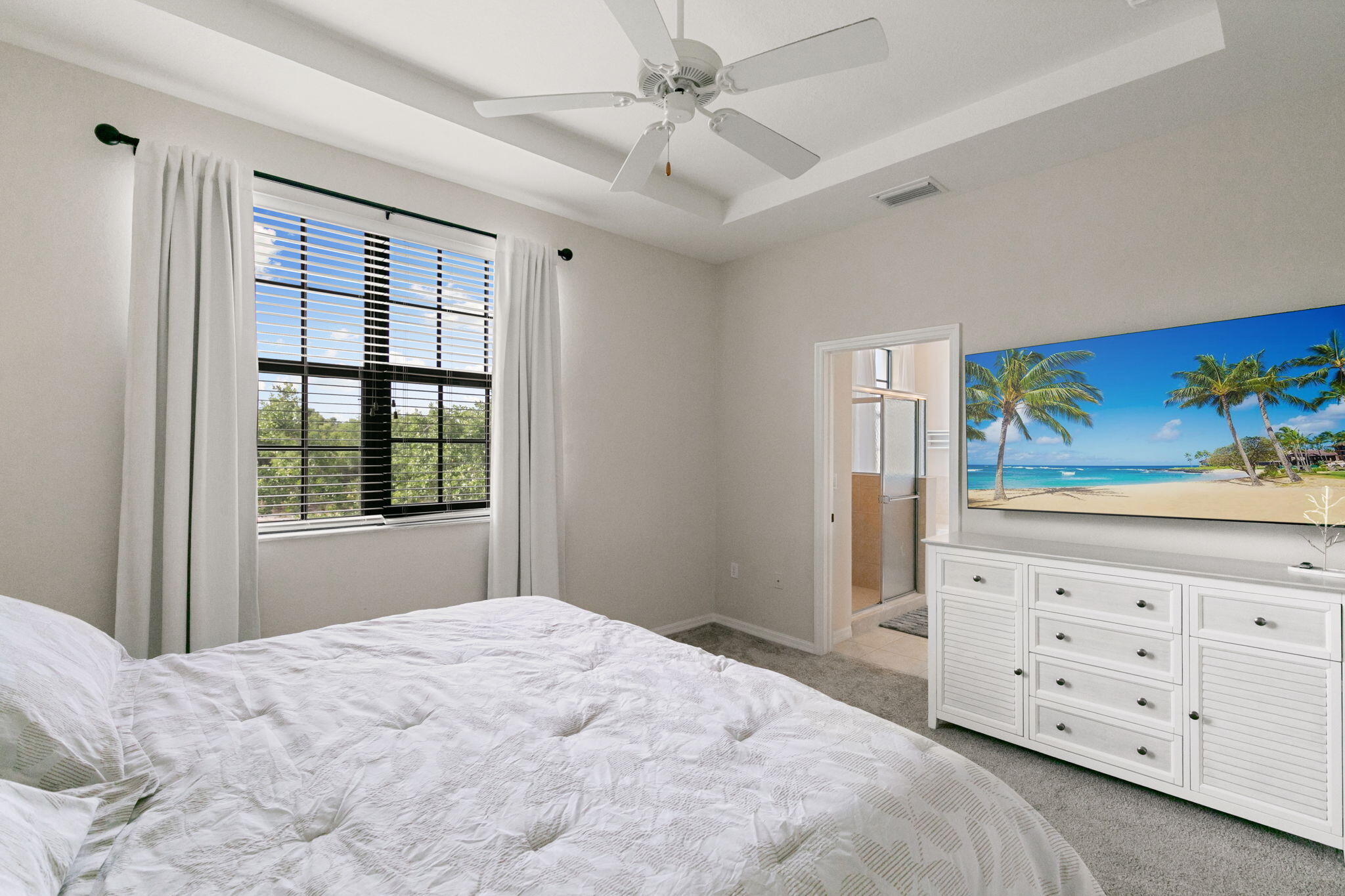 15068 Summit Pl Circle Naples, FL 34119 - Photo 14 of 29 a bedroom with a bed dresser and a window